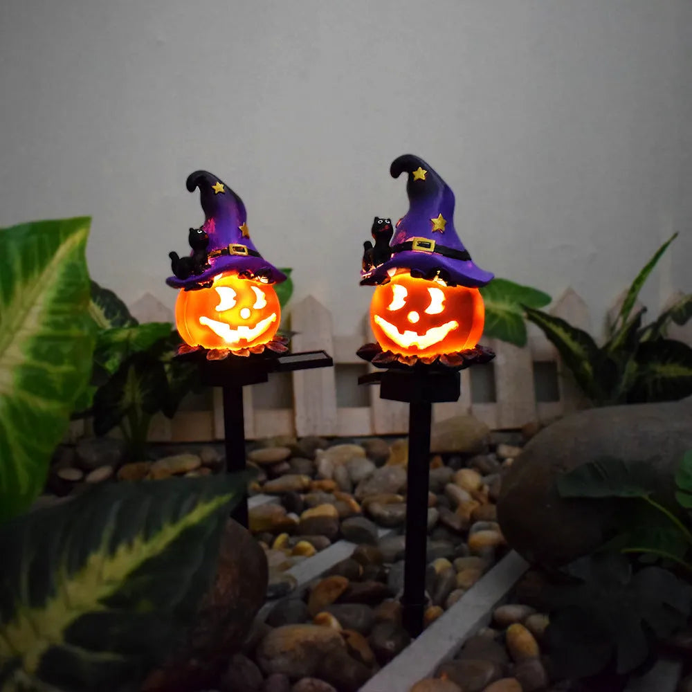 Solar Halloween pumpkin lantern on ground stake, wrought iron outdoor path light with 40x40mm solar panel, IP55 waterproof.