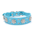 PU leather dog collar with studded rhinestone flower pattern in colour, showing metal D-ring and adjustable eyelets.