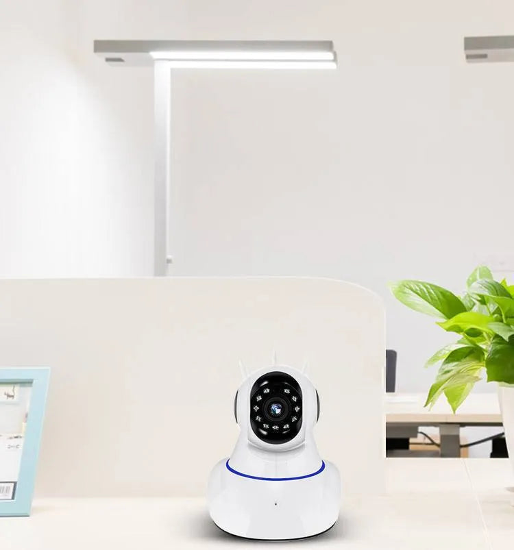 White wireless dome security camera showing front lens, mounted on a wall for surveillance.