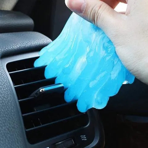 Blue and yellow magic cleaning gel putty for dust removal on a keyboard