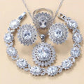 Garnet cubic zirconia four piece jewellery set including earrings necklace bracelet and ring with copper construction