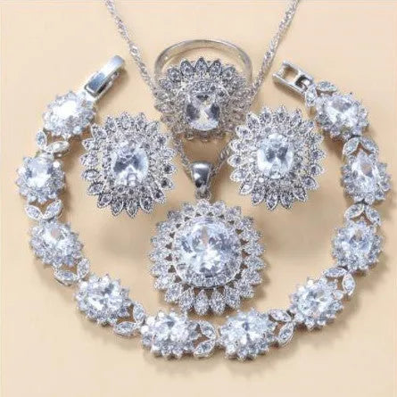 Garnet cubic zirconia four piece jewellery set including earrings necklace bracelet and ring with copper construction