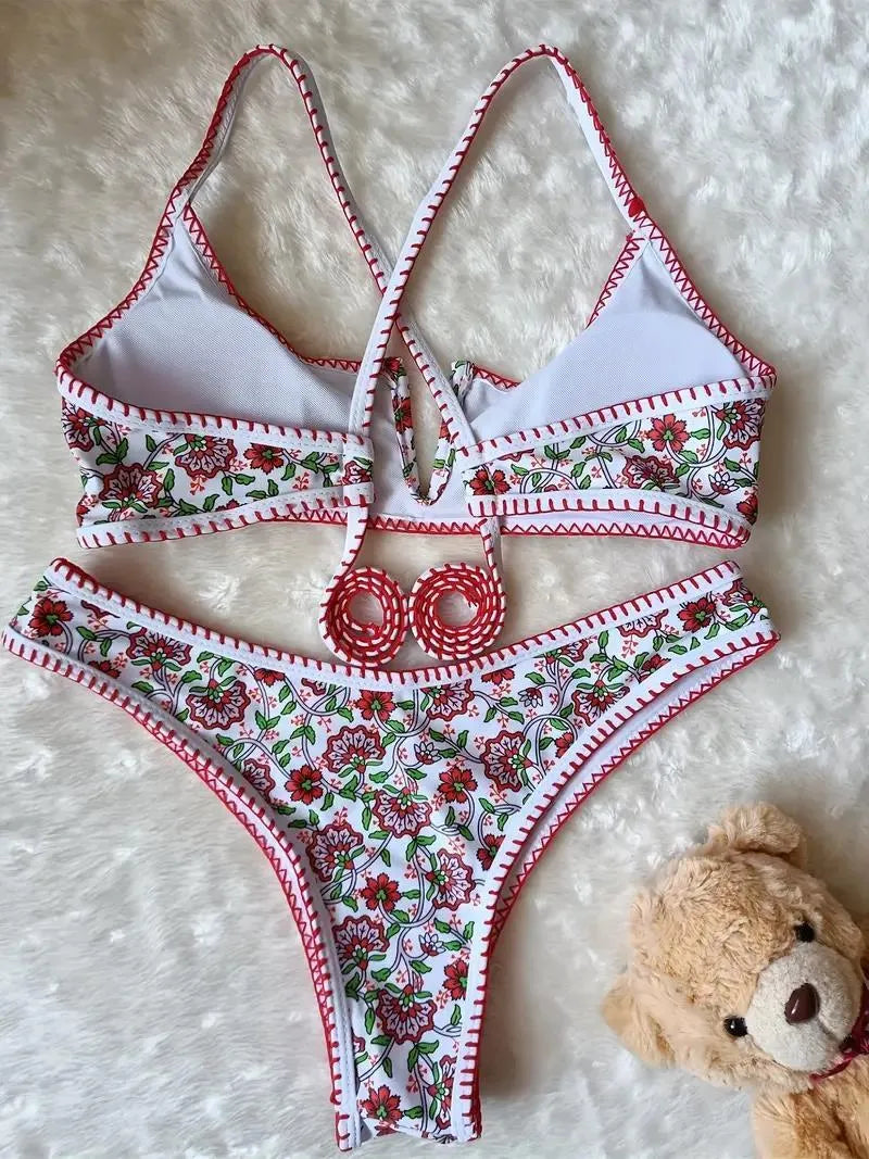 V-neck swimsuit with floral embroidery and printed patterns in brief cut design