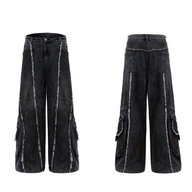 Black gradient distressed denim coat with padded shoulders and matching trousers on a hanger.