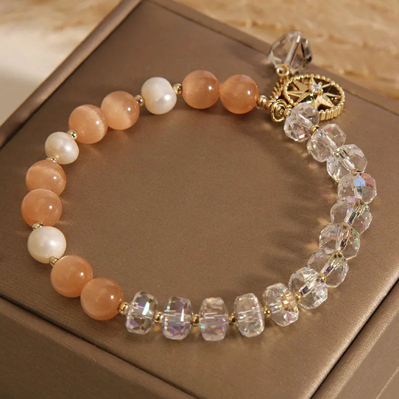 Orange opal crystal bracelet with gold-plated eight awn star design and artificial gemstone inlay