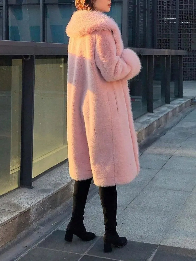 Women's grey faux rabbit fur and leather mid-length coat with a fur collar.