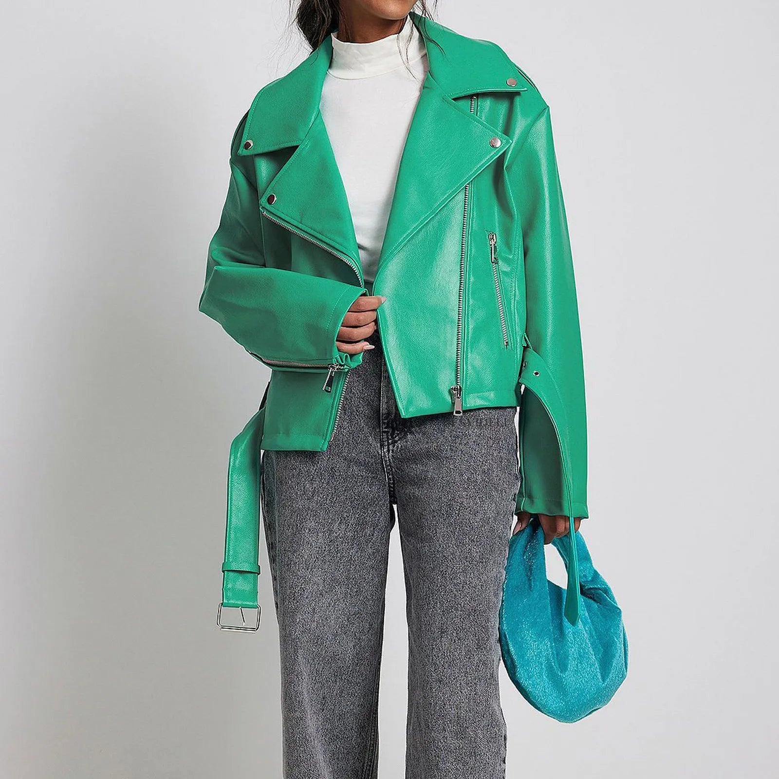 Black punk-style leather jacket with a Peter Pan collar, short belt on lapel, and a drawstring waist.