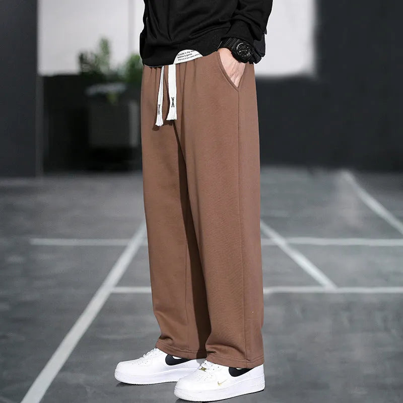 Men's grey bamboo fibre sports trousers with multiple pockets and high waist design