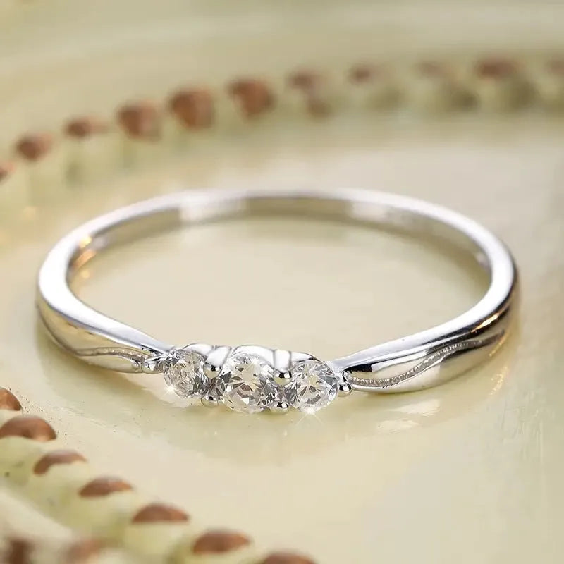 S925 sterling silver ripple wave gang drill ring on white background, white gold plating, US sizes 6-9