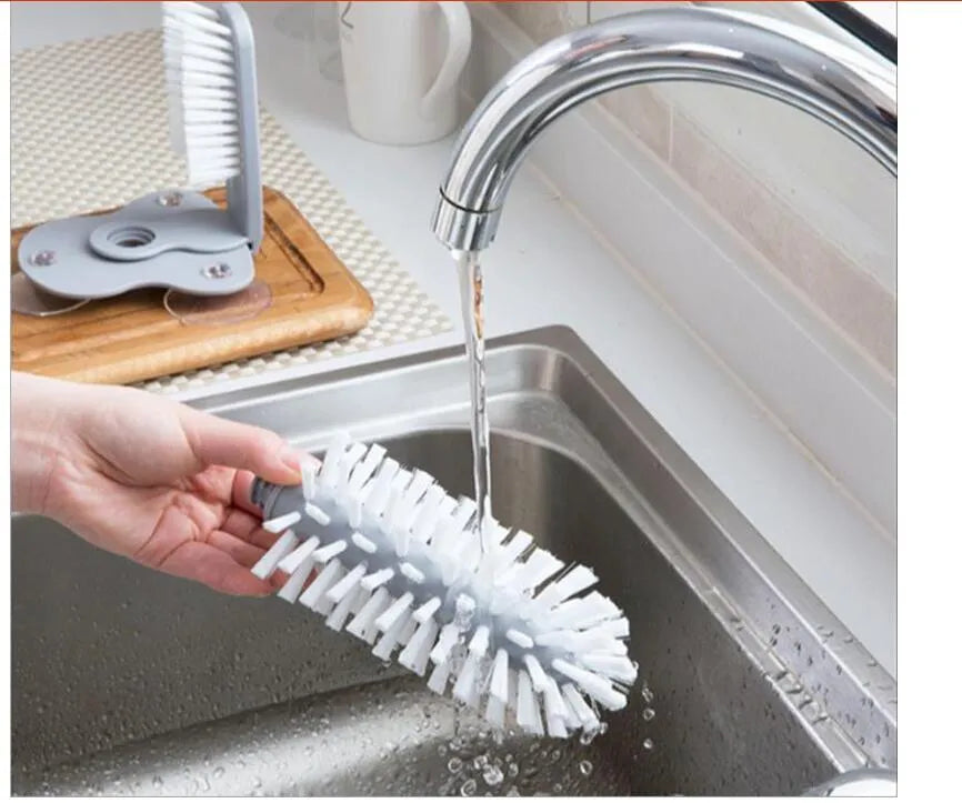 Grey double-head rotating cup brush with suction cups for wall mounting, length 17.5cm.