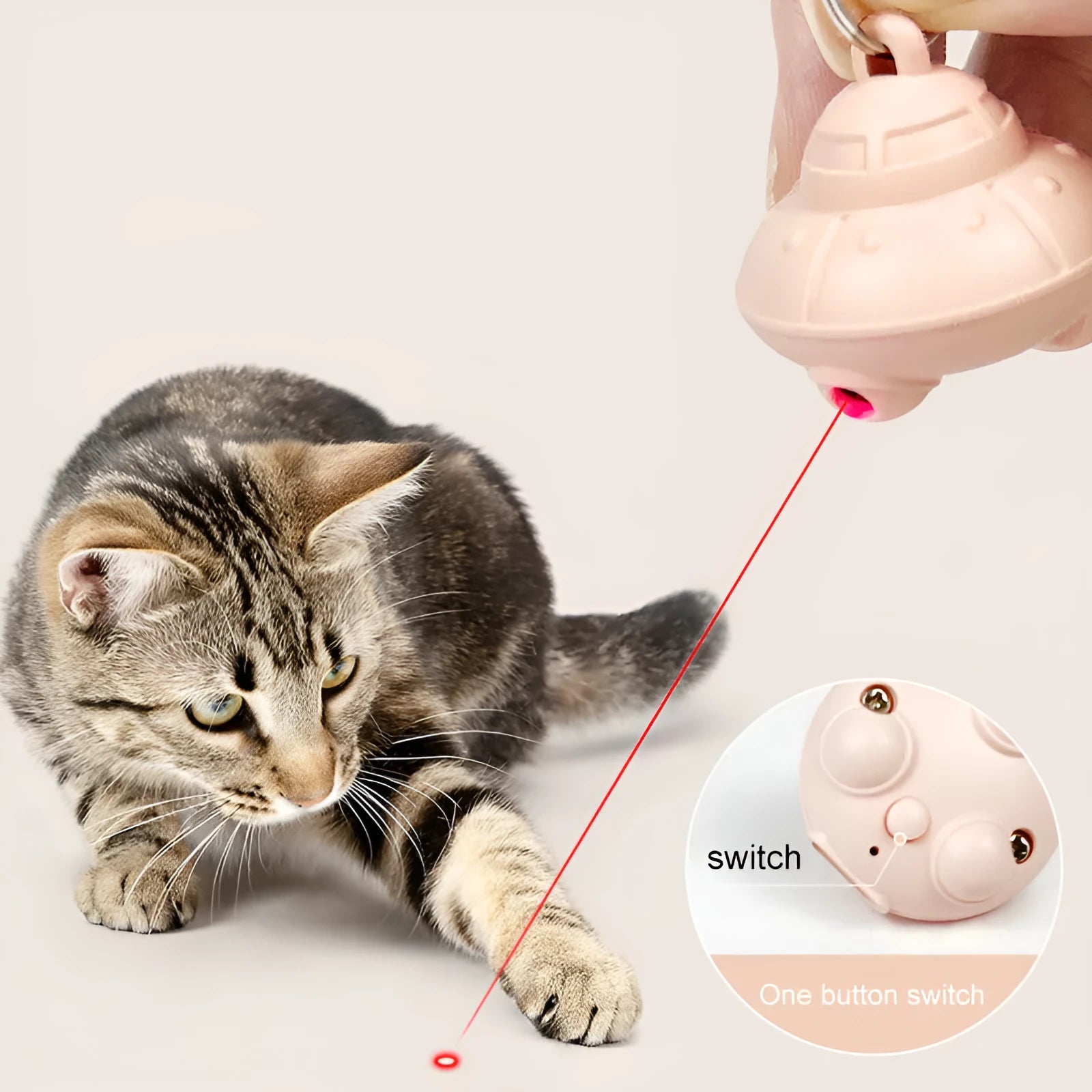 Green cat collar with attached small laser toy unit showing USB charging port.