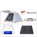 White fully automatic quick-open camping tent with aluminium poles, double-layer construction, pitched outdoors in a field