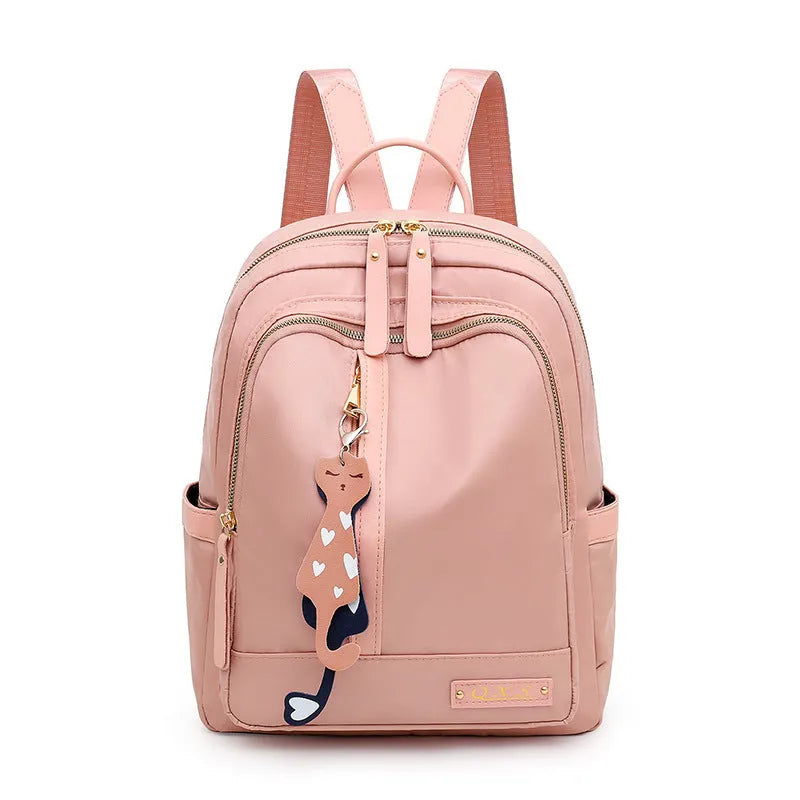 Men's black nylon casual backpack with double straps, a soft handle, and external pocket.