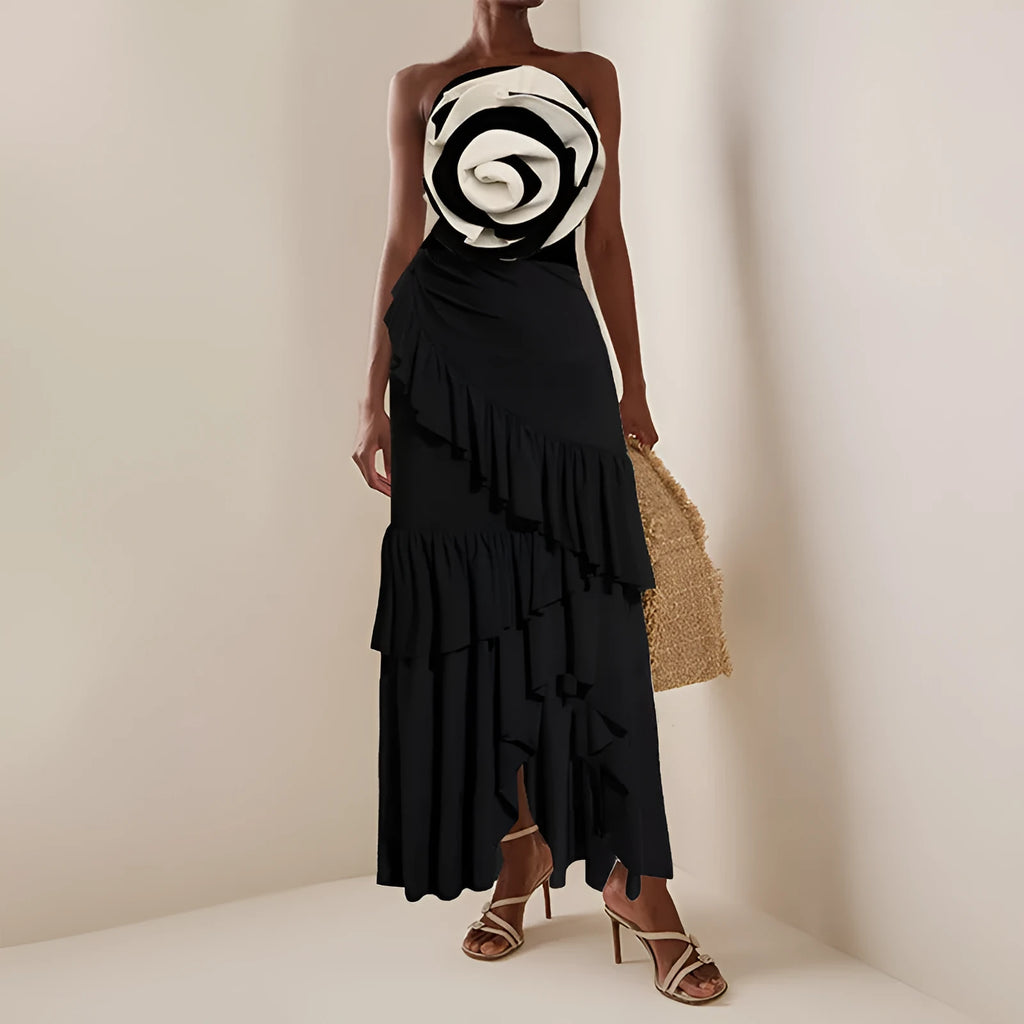 Women's black and white one-piece swimsuit with a matching black skirt, shown alongside a solid red swimsuit and skirt set.