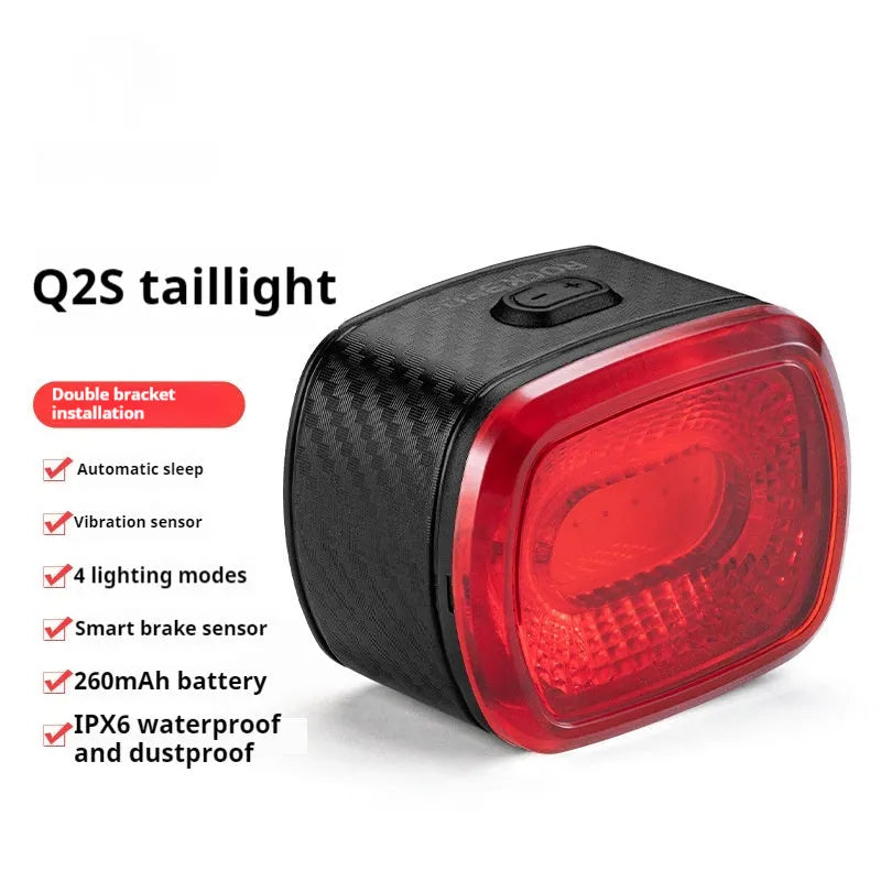 Black smart bicycle taillight with intelligent induction stop lamp mounted on bike frame