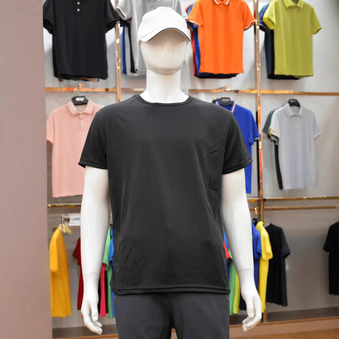 Quick-drying slim fit men's polyester T-shirt in a solid colour on a hanger.