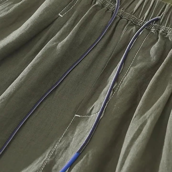 Men's linen shorts in straight drooping style with drawstring waist in black or green colour
