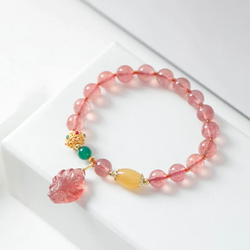 Women's strawberry quartz crystal bracelet with Nine Tail Fox beaded design