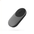 Black and white wireless portable mouse with Bluetooth connectivity for laptop use