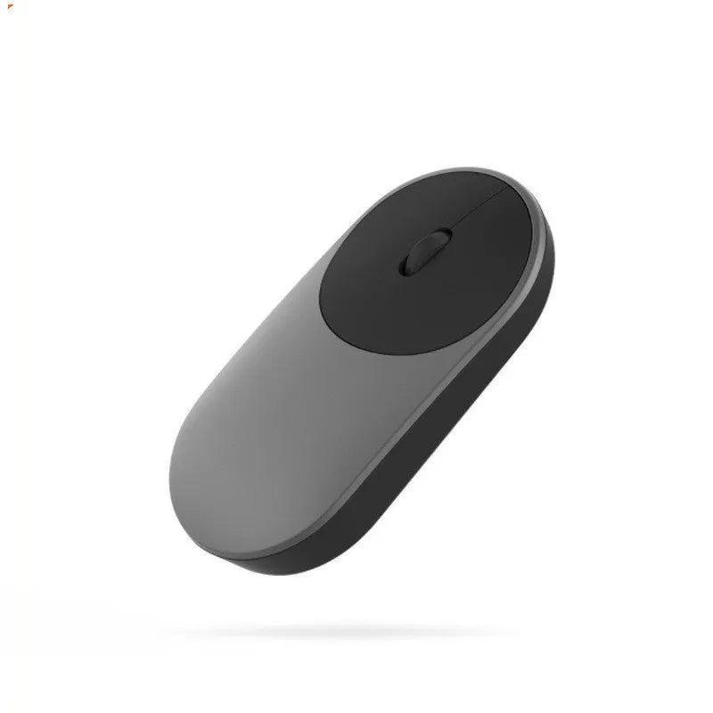 Black and white wireless portable mouse with Bluetooth connectivity for laptop use