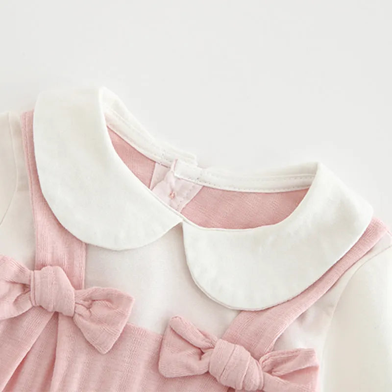Pink 100% cotton embroidered jumpsuit for a baby girl, with long sleeves and single-breasted closure.