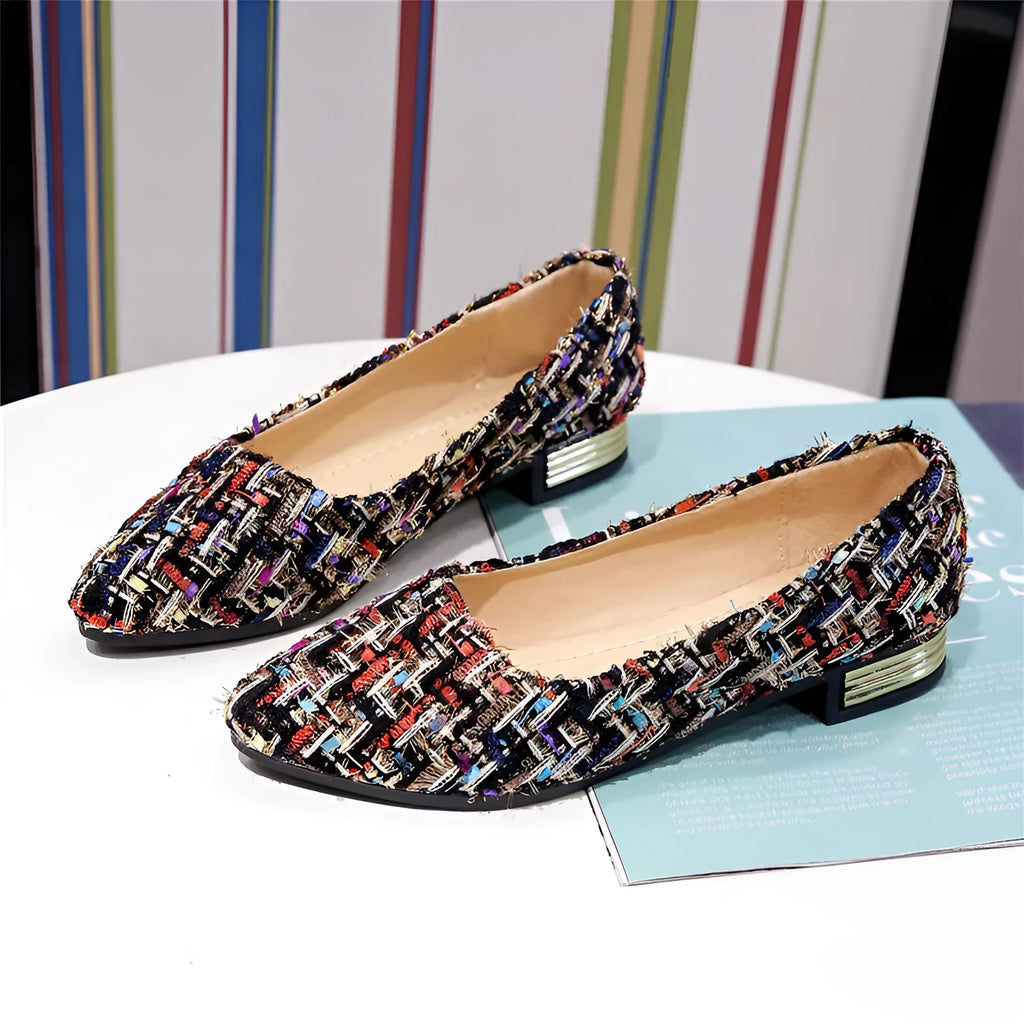 Women's black and white canvas flats with flower pattern, pointed toe, and low-cut design
