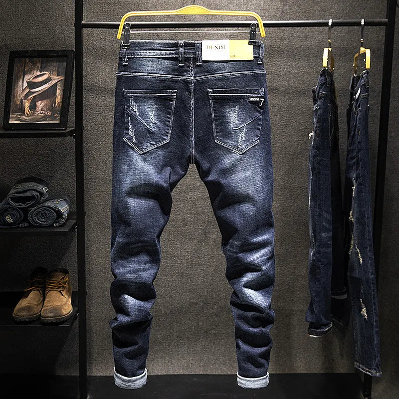 Men's slim-fit blue jeans with a mid-waist, shown in dark blue and light blue colour options.