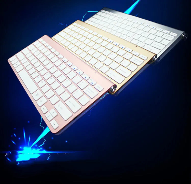 2.4G wireless keyboard and mouse combo set in silver colour on a desk with laptop