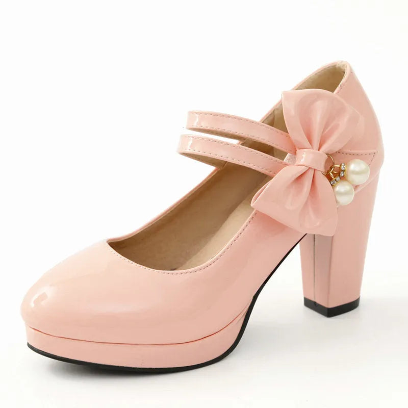 Red waterproof platform shoes with a thick chunky heel, round toe, and buckle fastening on the side.
