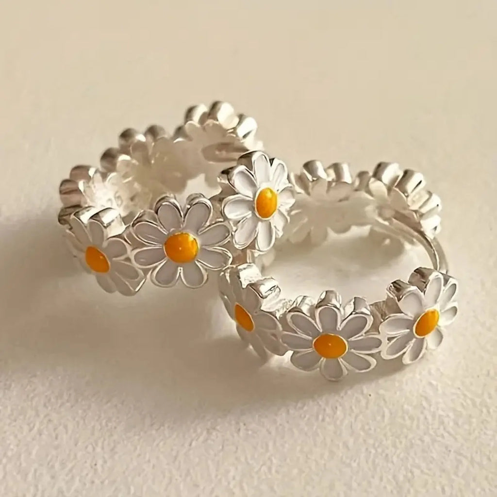 White daisy flower fashion earrings with platinum gem accents on copper base
