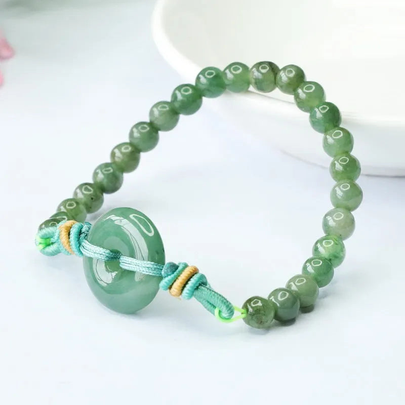 Oil green jade bracelet with star-shaped beads and a silver safety buckle clasp.