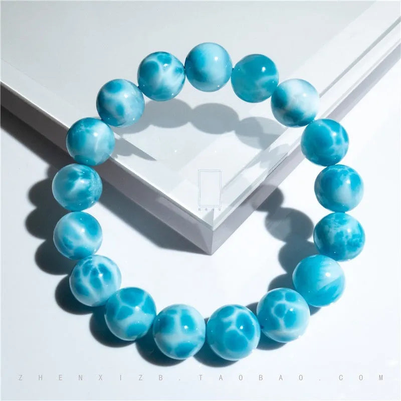 Blue bodhi bracelet with natural crystal sea-pattern stone centrepiece and pearl details in Maillard style