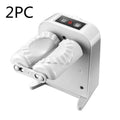 White electric automatic dumpling maker machine with accessories on a kitchen counter.