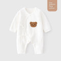 White cotton newborn jumpsuit with top fly lace closure and jacquard teddy bear straps