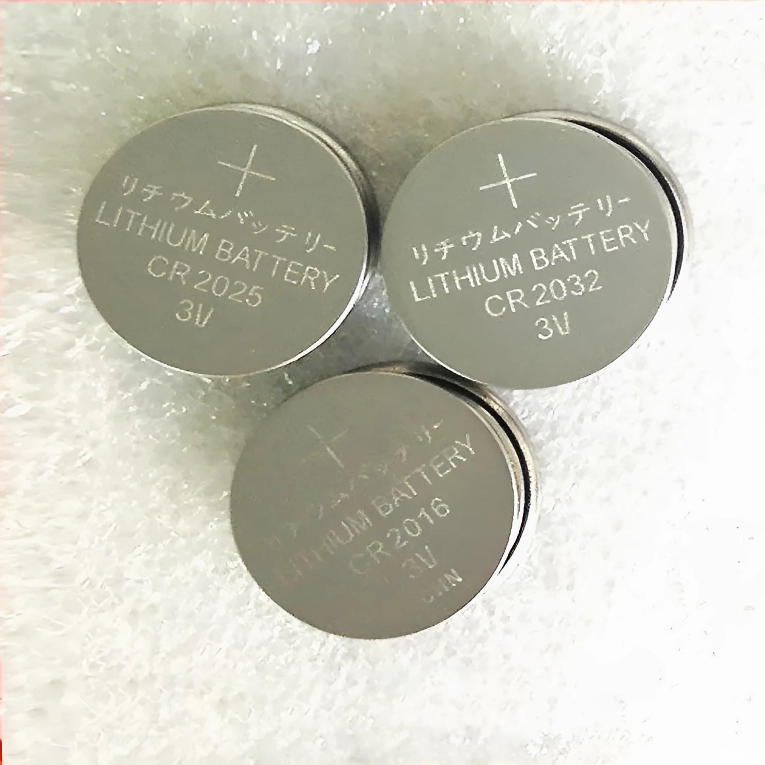 Three 3V button batteries: CR2016, CR2025, and CR2032 models showing size comparison.