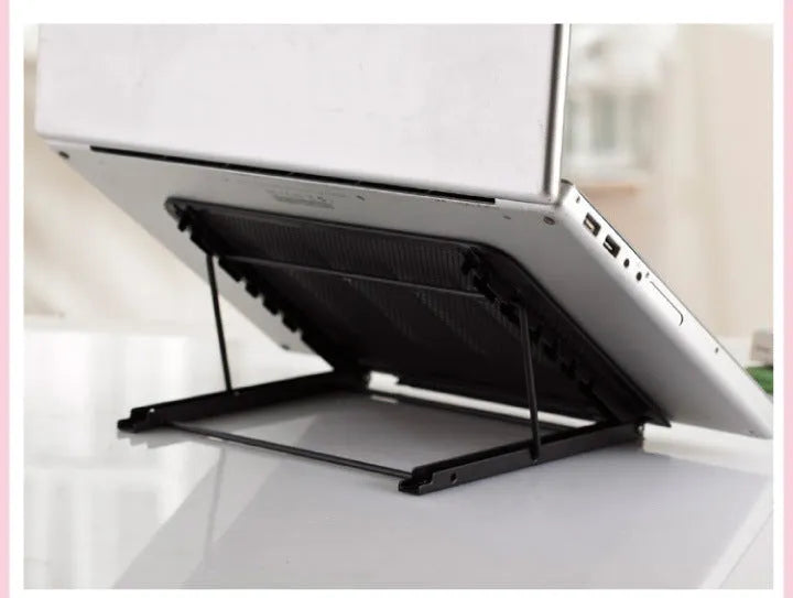 Silver folding laptop stand holding a laptop at an angle