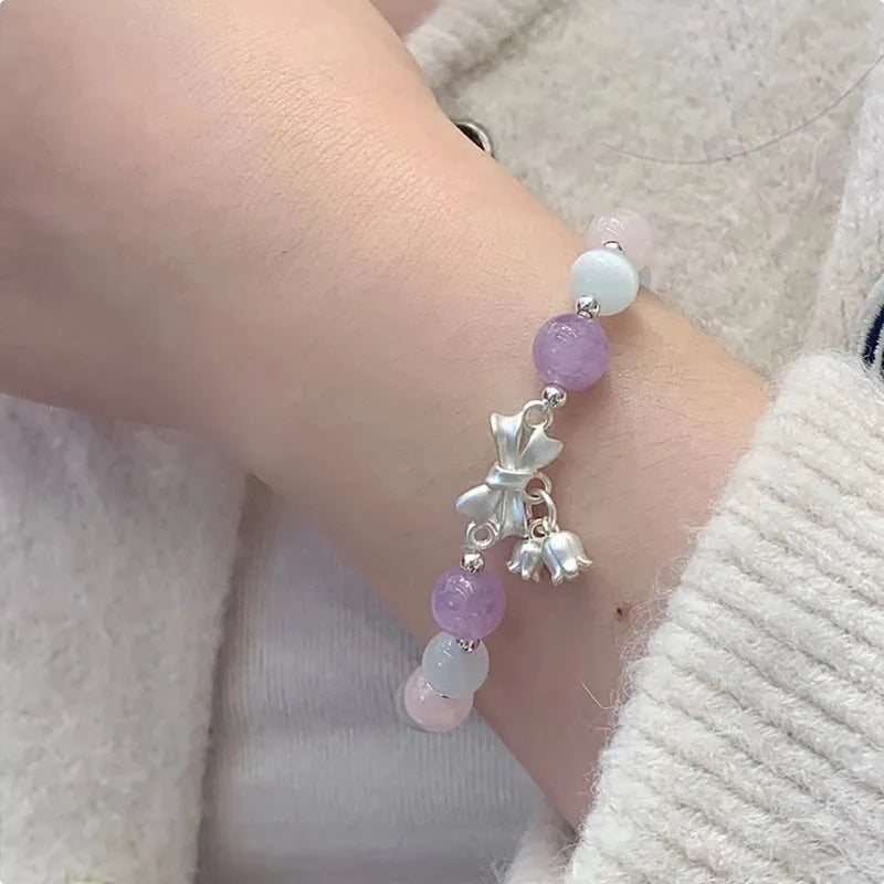 Lavender purple bowknot opal crystal bracelet with electroplated finish for women.
