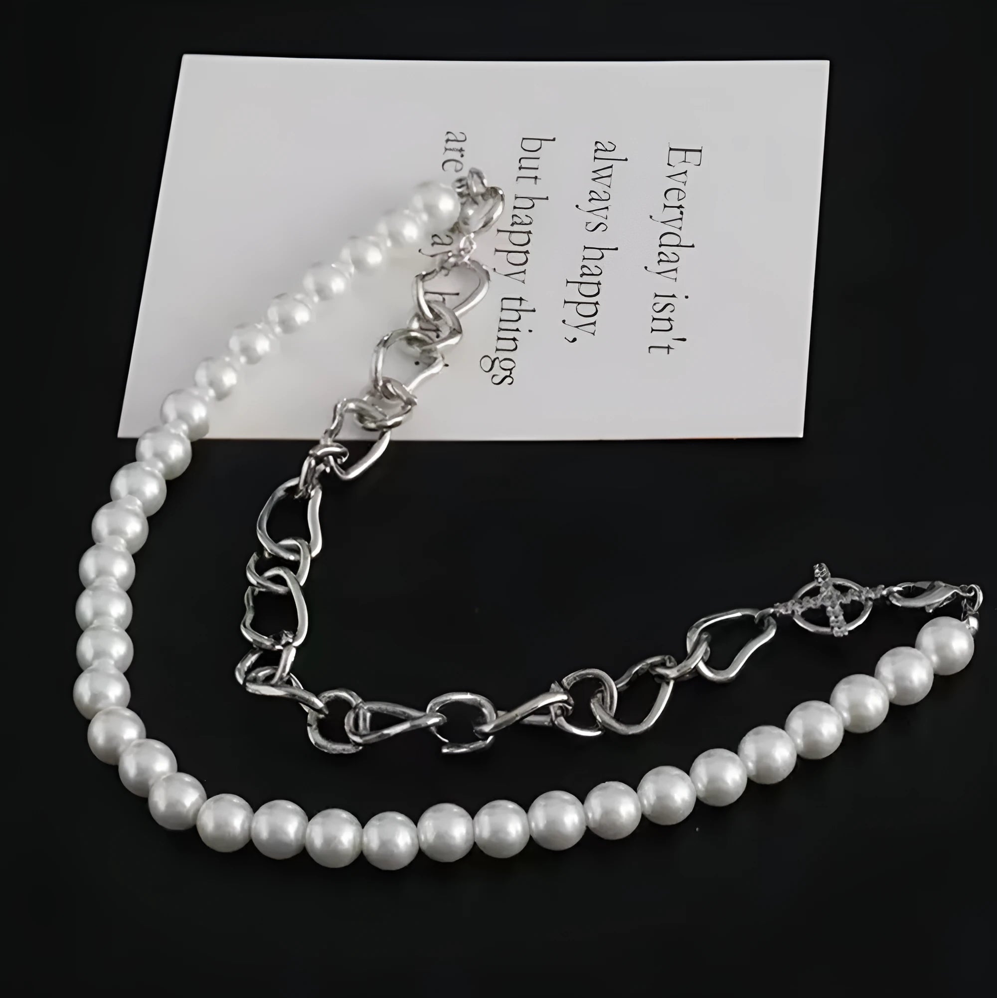 White geometric acrylic asymmetrical pendant on twisted chain clavicle necklace