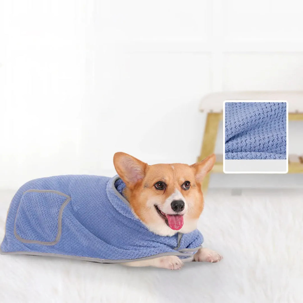 Blue adjustable dog bath robe towel wrapped around a dog, showing the waistband fastener and absorbent fabric.
