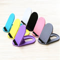 Plastic lazy bracket mobile phone stand in multiple colour options on desk