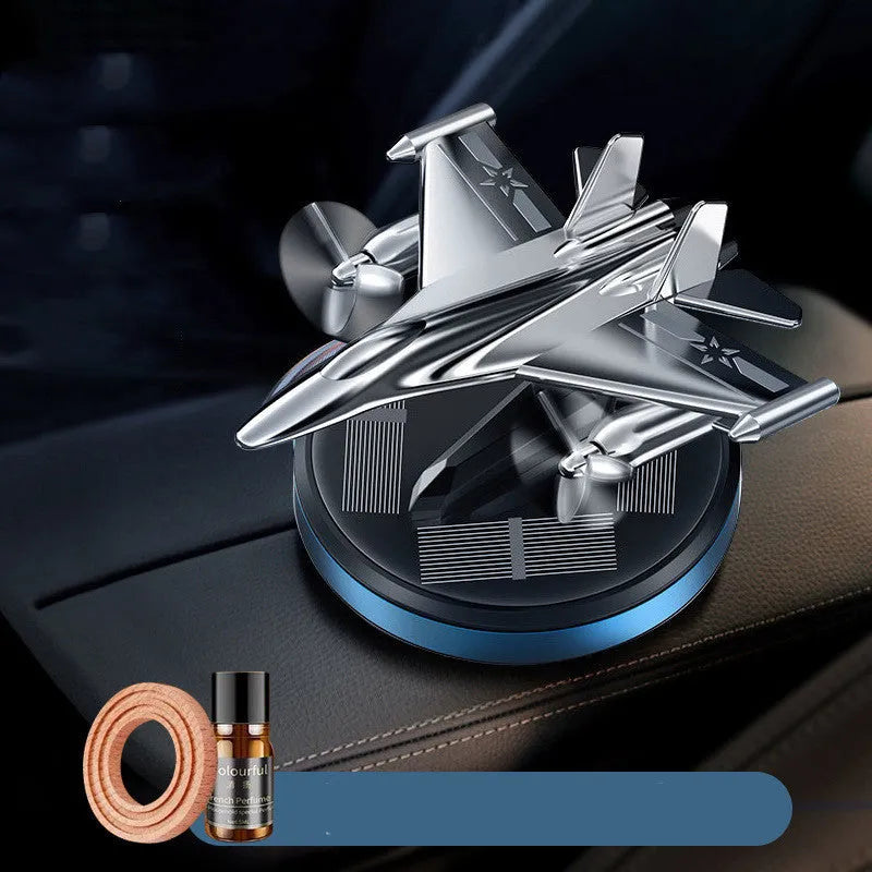 Solar powered rotating aluminium alloy fighter jet perfume ornament in silver, gold, blue, or red colour.
