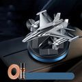 Solar powered rotating aluminium alloy fighter jet perfume ornament in silver, gold, blue, or red colour.