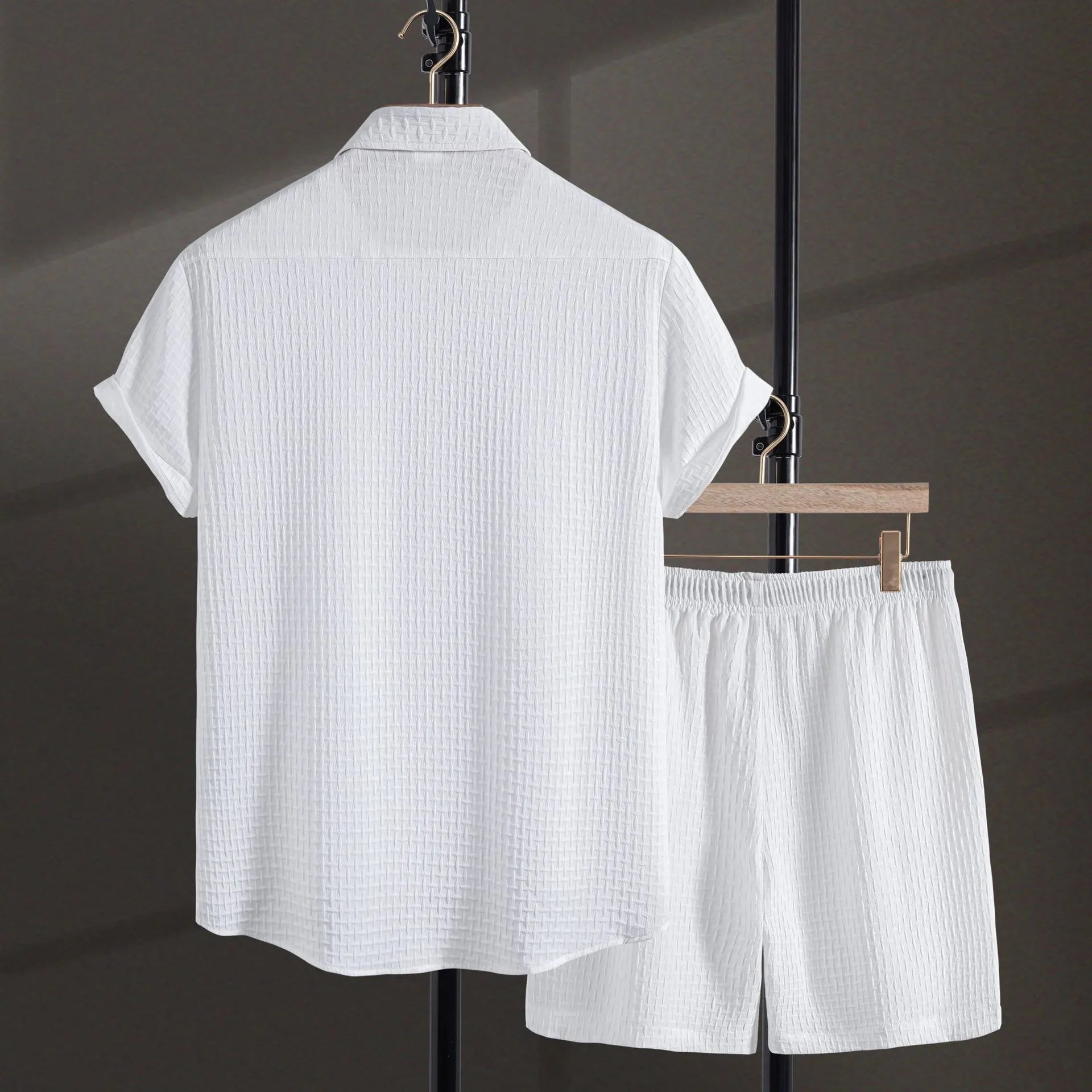 Men's black cotton blend short sleeve shirt and shorts casual suit set on a white background.