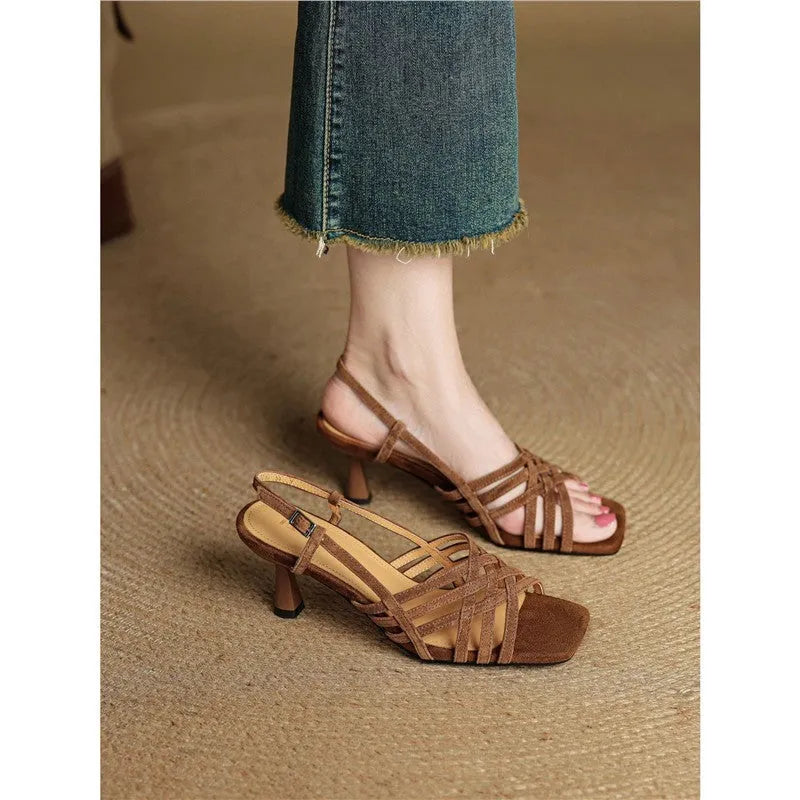 Retro soft leather thin cross strap high heel sandals fastened with an ankle buckle.