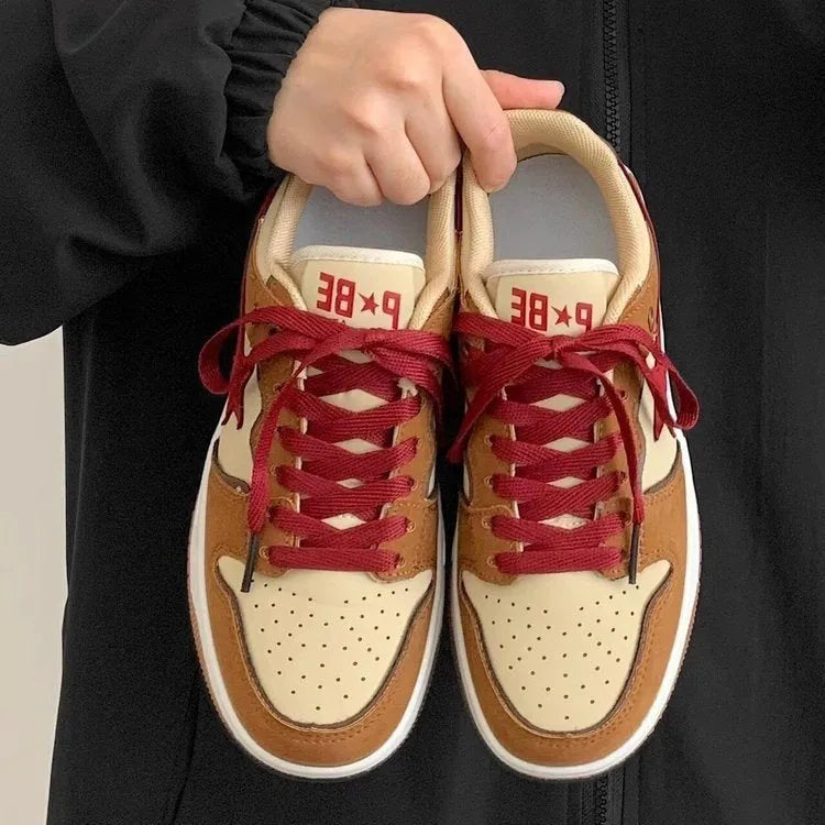 Brown women's platform sneakers with sequin detailing and lace-up front