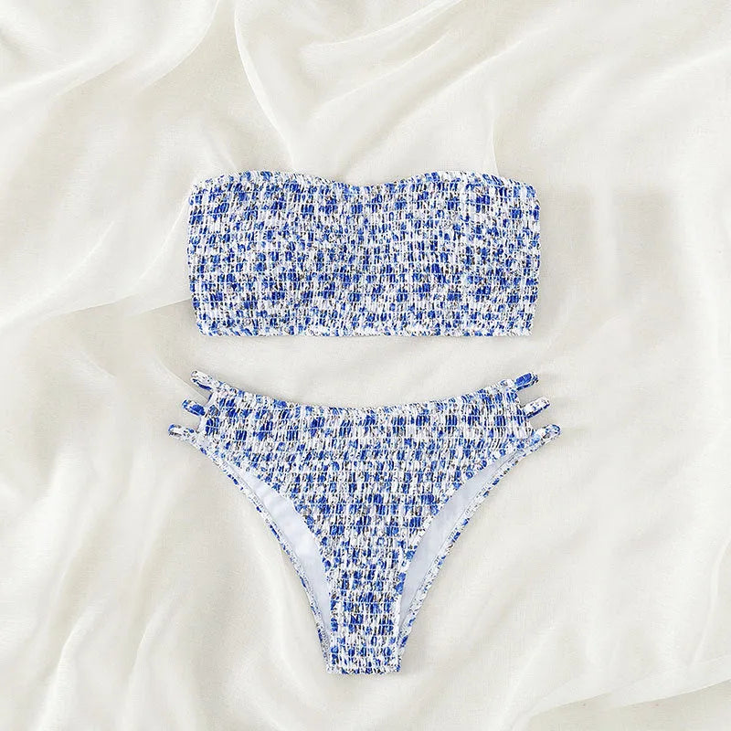 Women's floral strapless swimsuit with split back and high-waist briefs on white background.