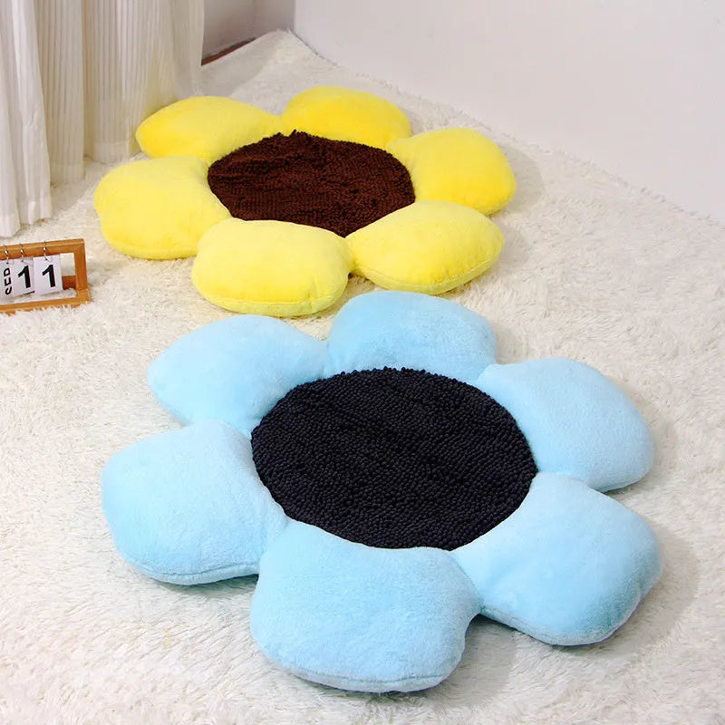 Blue round flower-shaped plush pet nest bed for cats on a wooden floor