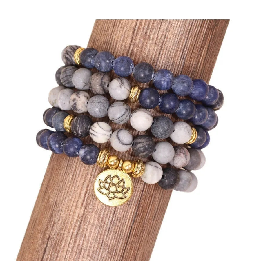 Blue multi layer bracelet with patterned network stone beads on alloy strands