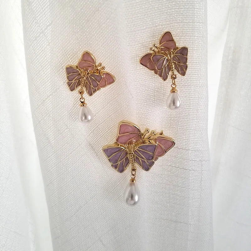 Vintage enamel butterfly brooch with pearl accents on alloy base