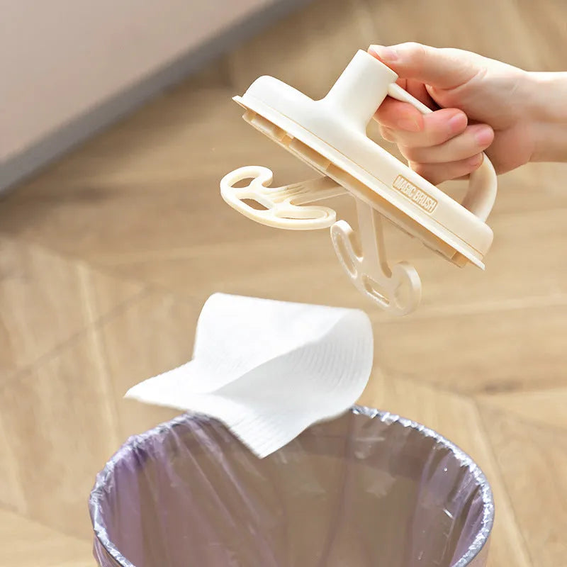 Magic disposable cleaning brush with plastic handle and packet of 50 white non-woven fabric refill wipes.
